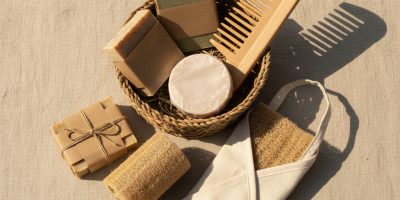 gemini-2.5-flash-image_A_beautifully_styled_flat_lay_of_eco-friendly_personal_care_products_arranged_to-0
